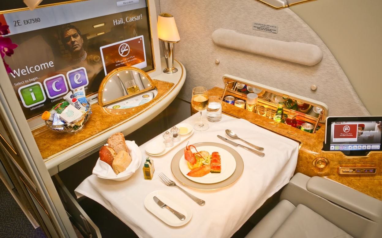 Multi-course business class meal served with real glassware and china
