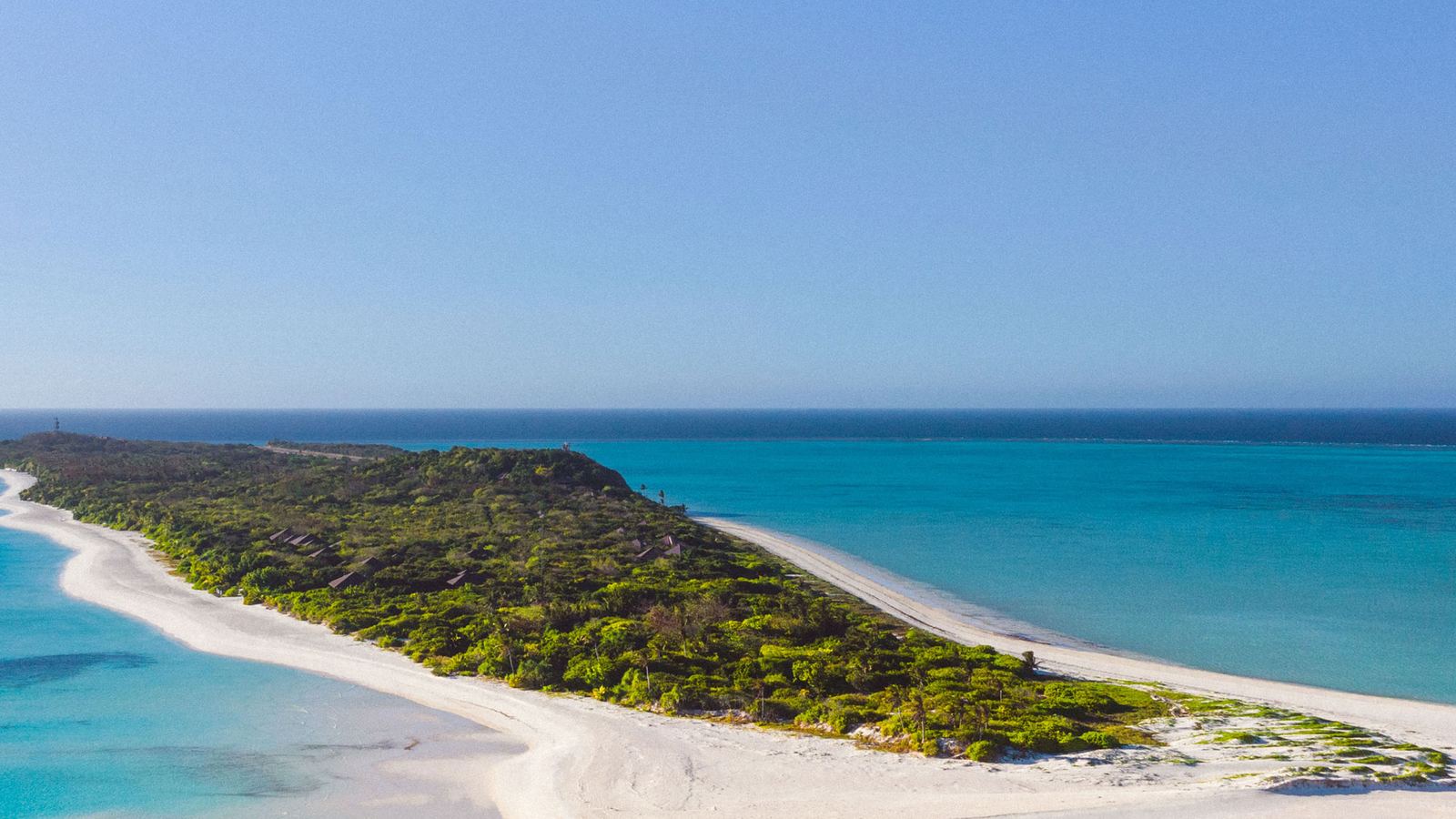 Aerial view of Amanpulo's private island of Pamalican in the Philippines, white sandbar and turquoise reef